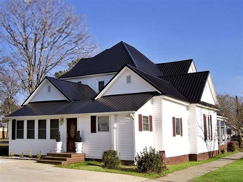 vlack metal roof with white house|white metal roof exterior homes.